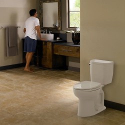 Entrada™ inodoro alargado con acoplamiento cerrado 1.28GPF Algodón